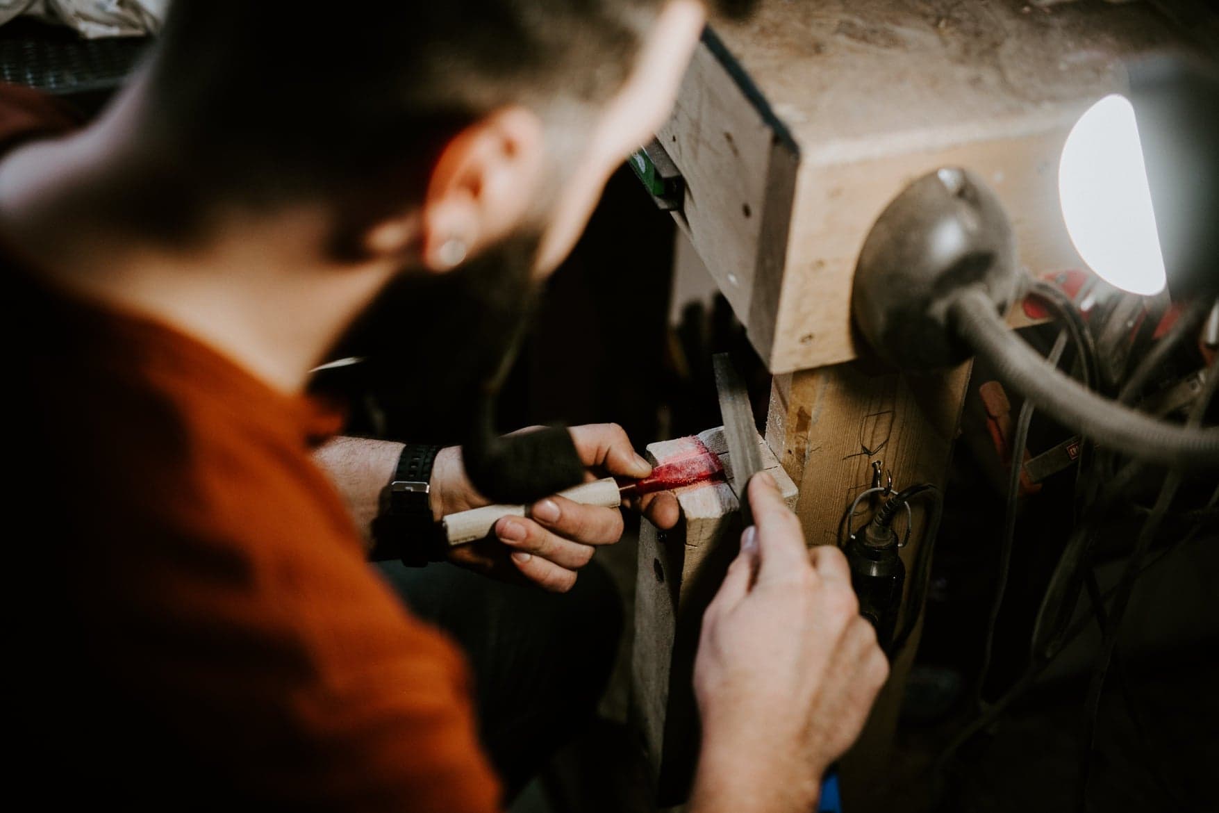 Nate Rose shaping a pipe at the lathe